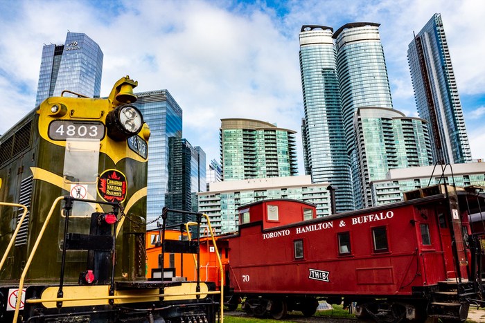 Colourful railway engines against the Toronto skyline