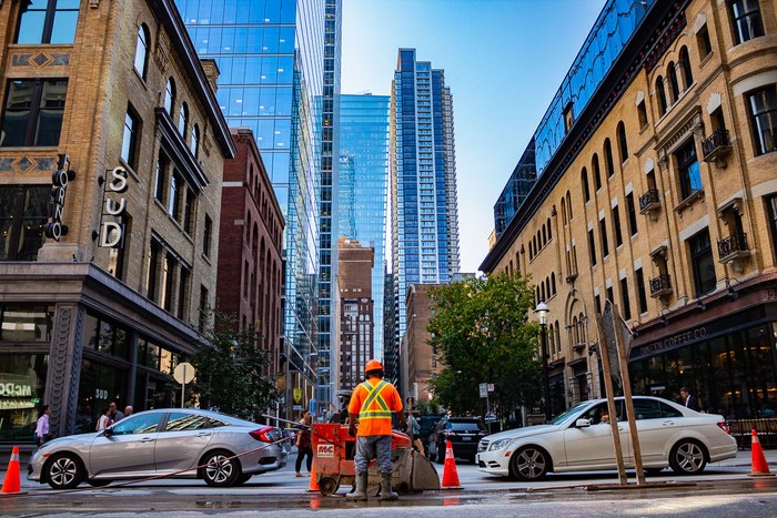 Downtown Toronto street scene framed by high-rise architecture