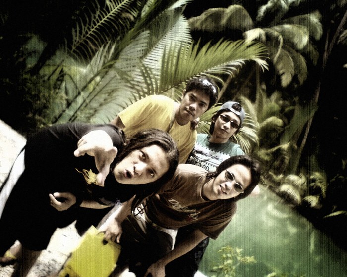 Group portrait beside a waterfall with a dramatic colour treatment